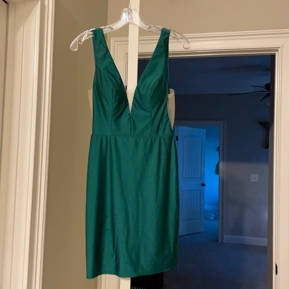 green Amarra homecoming dress from Bella’s with mesh on chest and sides